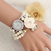 Pearl diamond bracelet around the wrist of fashion watch