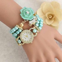 Pearl diamond bracelet around the wrist of fashion watch