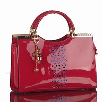 Patent leather hollow fashion portable package